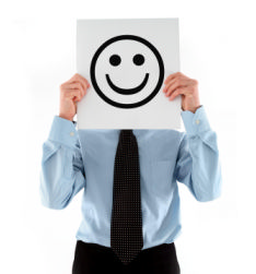 The photo shows a jobseeker smiling because he has found the careers advice helpful in his search for a new job