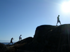 This image shows 3 people climbing a mountain. Finding a job after redundancy can seem like an uphill struggle but by following this advice you can reach the top of the mountain and get the job you wa